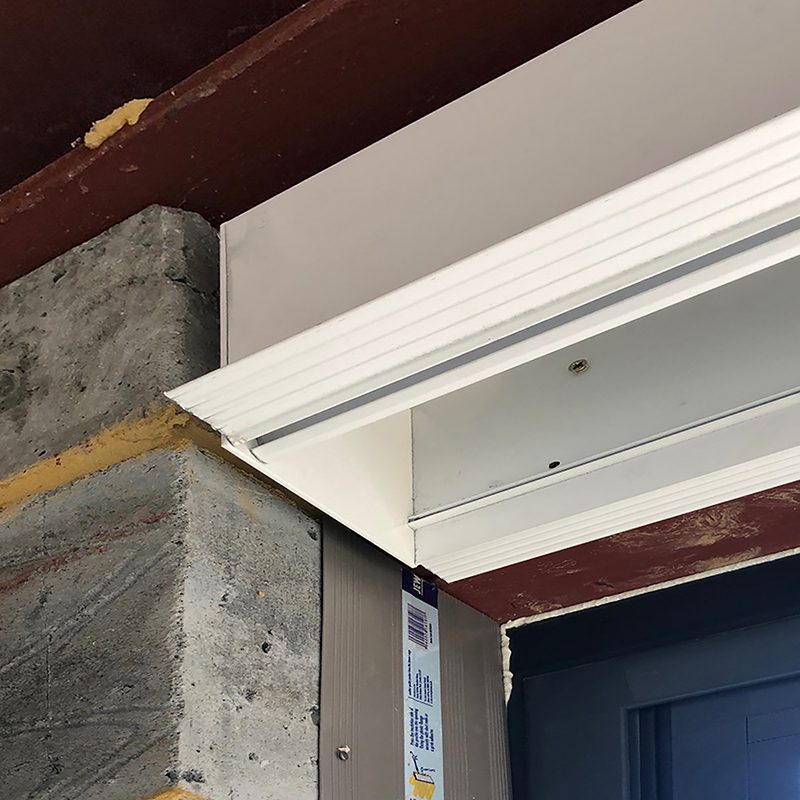 Blindspace concealment pocket fixed to framing before drywall, with skim coat flanges ready for plaster