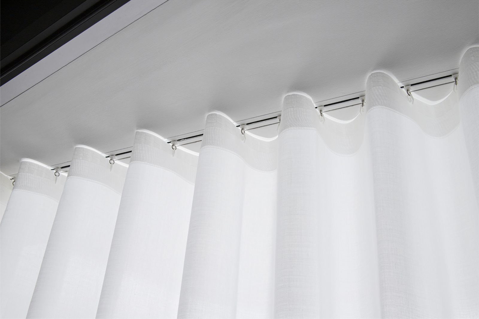 Ripplefold sheer hanging from a recessed track, Blindspace supplier photo
