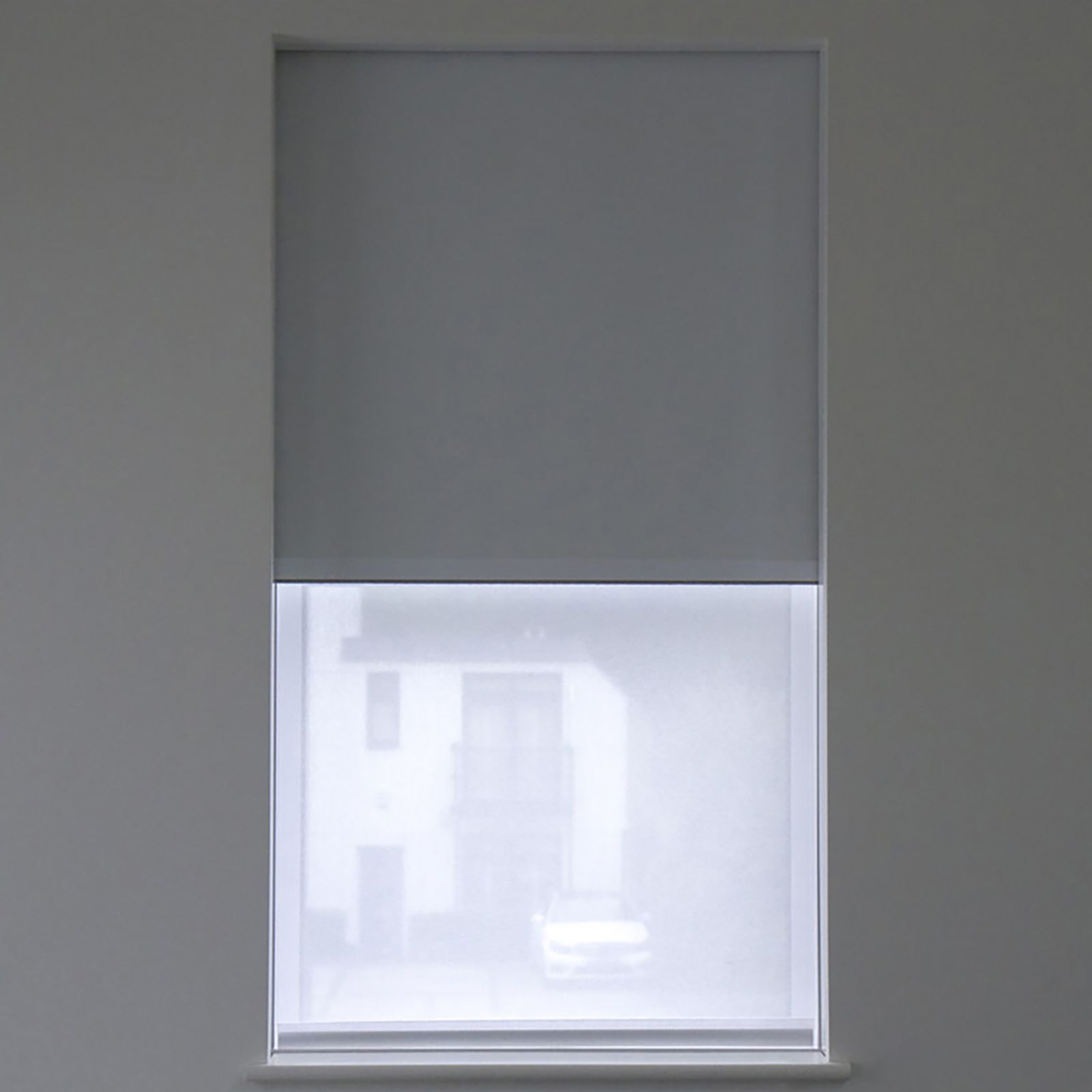 Roller shade half lowered from a concealed ceiling pocket, Blindspace supplier photo