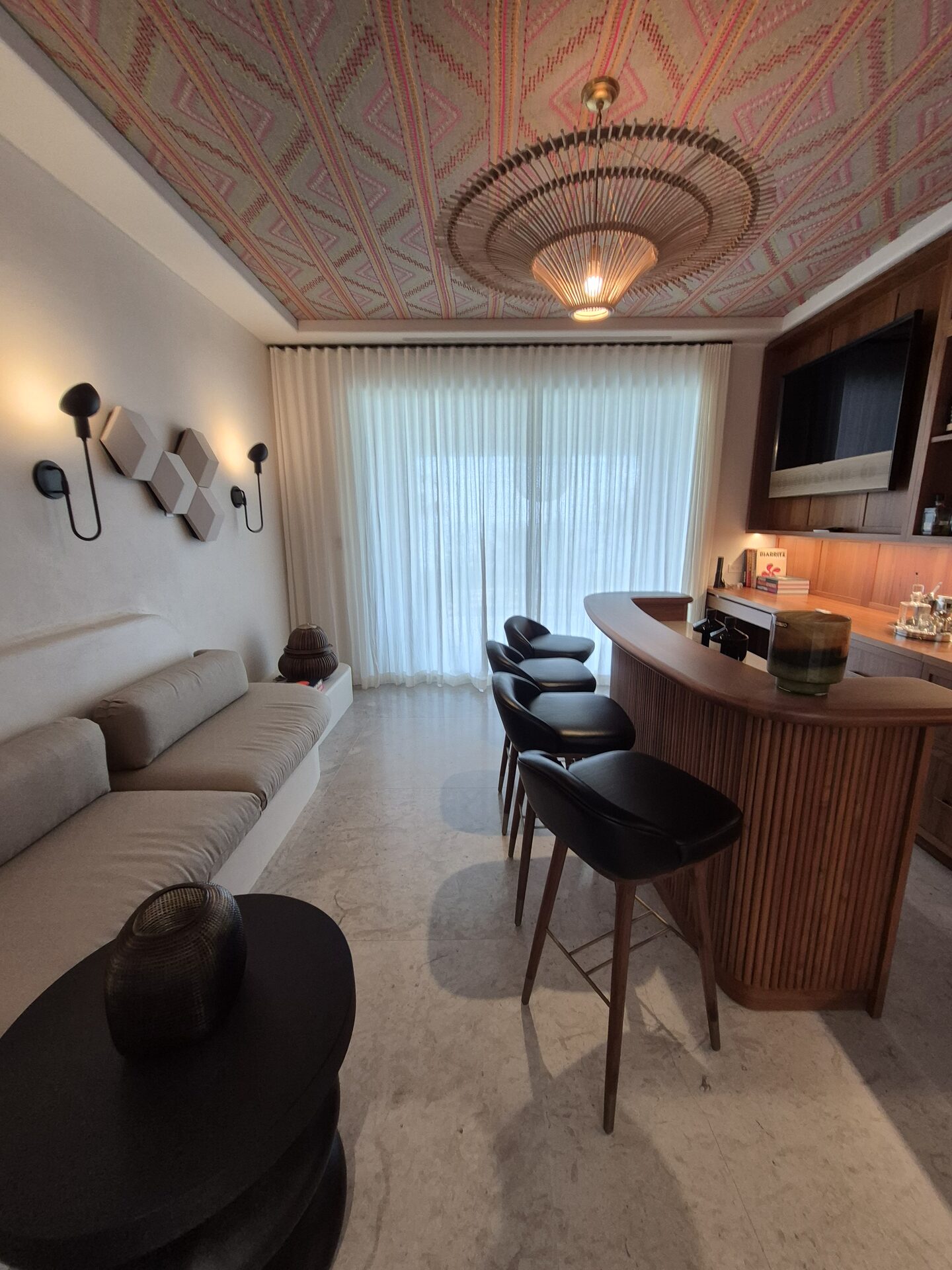 Drapery-framed bar and lounge in an automated South Florida residence