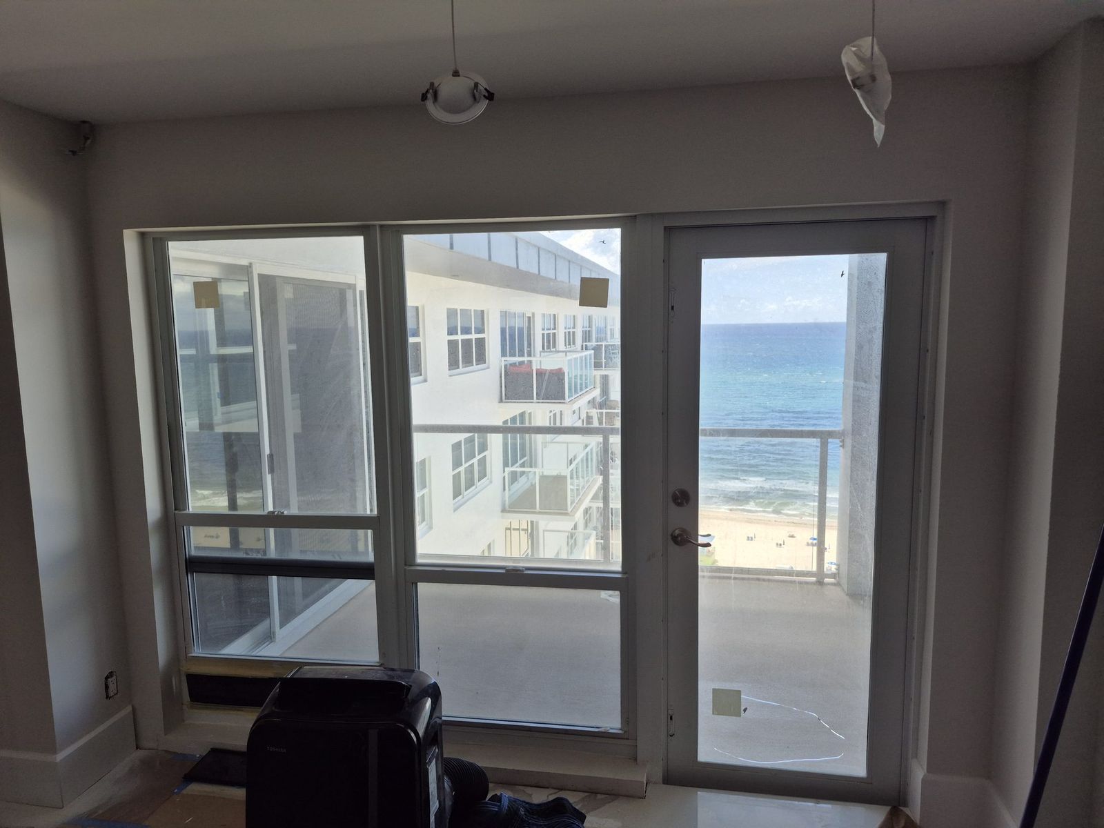 Battery motorized shades in an oceanfront condo