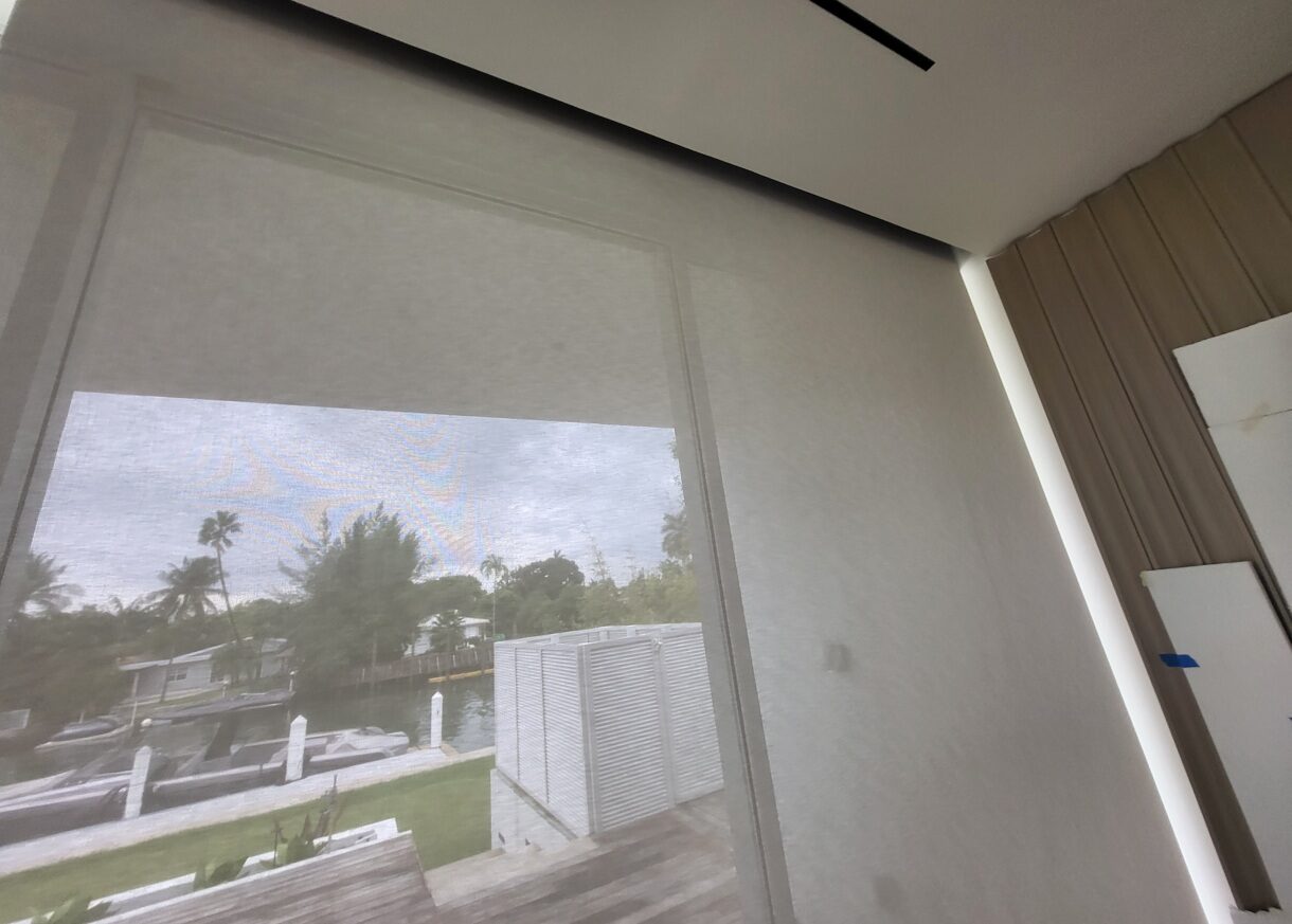 Somfy-powered solar shade preserving a canal view