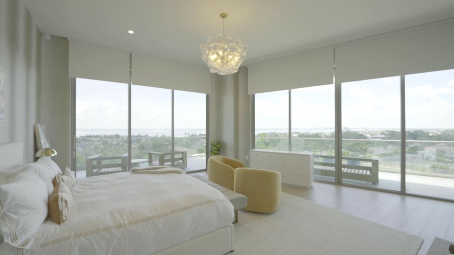 Primary bedroom with chandelier, motorized roller shades and Décor de Paris Luna Sheer drapery, St. Regis Longboat Key