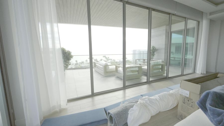 Sheer draperies drifting across the bay wall at the St. Regis Longboat Key, Sarasota