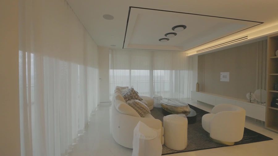 Loro Piana Interiors Limoges White ripplefold sheers across the great room glass at the Ritz-Carlton Residences Sunny Isles Beach
