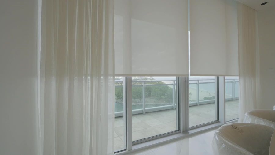 T-Screen 3% solar shade layered behind sheer draperies in a Sunny Isles Beach residence