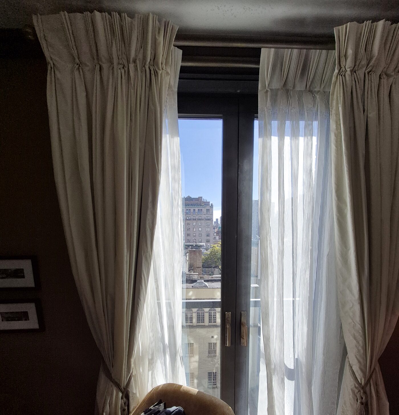 Camelia chenille drapes and striped sheer drawn against the New York light