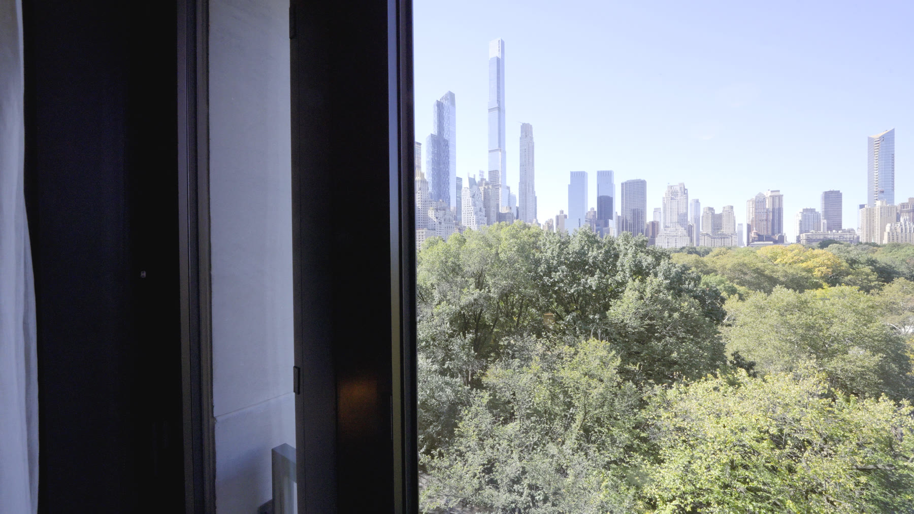 Central Park and the Billionaires Row skyline through the residence's French door