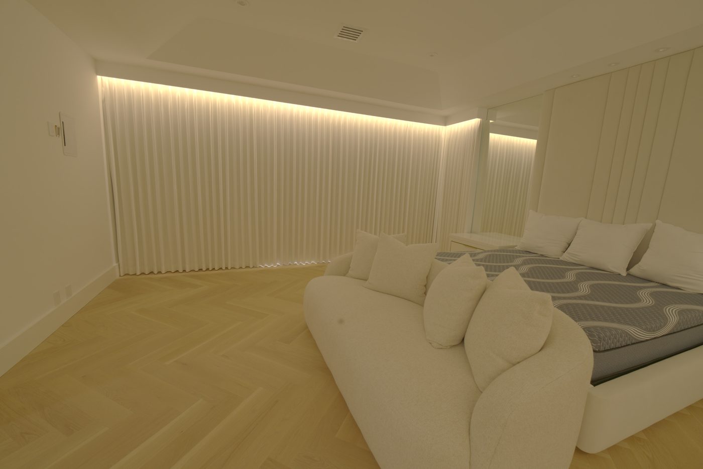 Master bedroom with the Kravet Smart ripplefold drapery closed under the custom wood valance