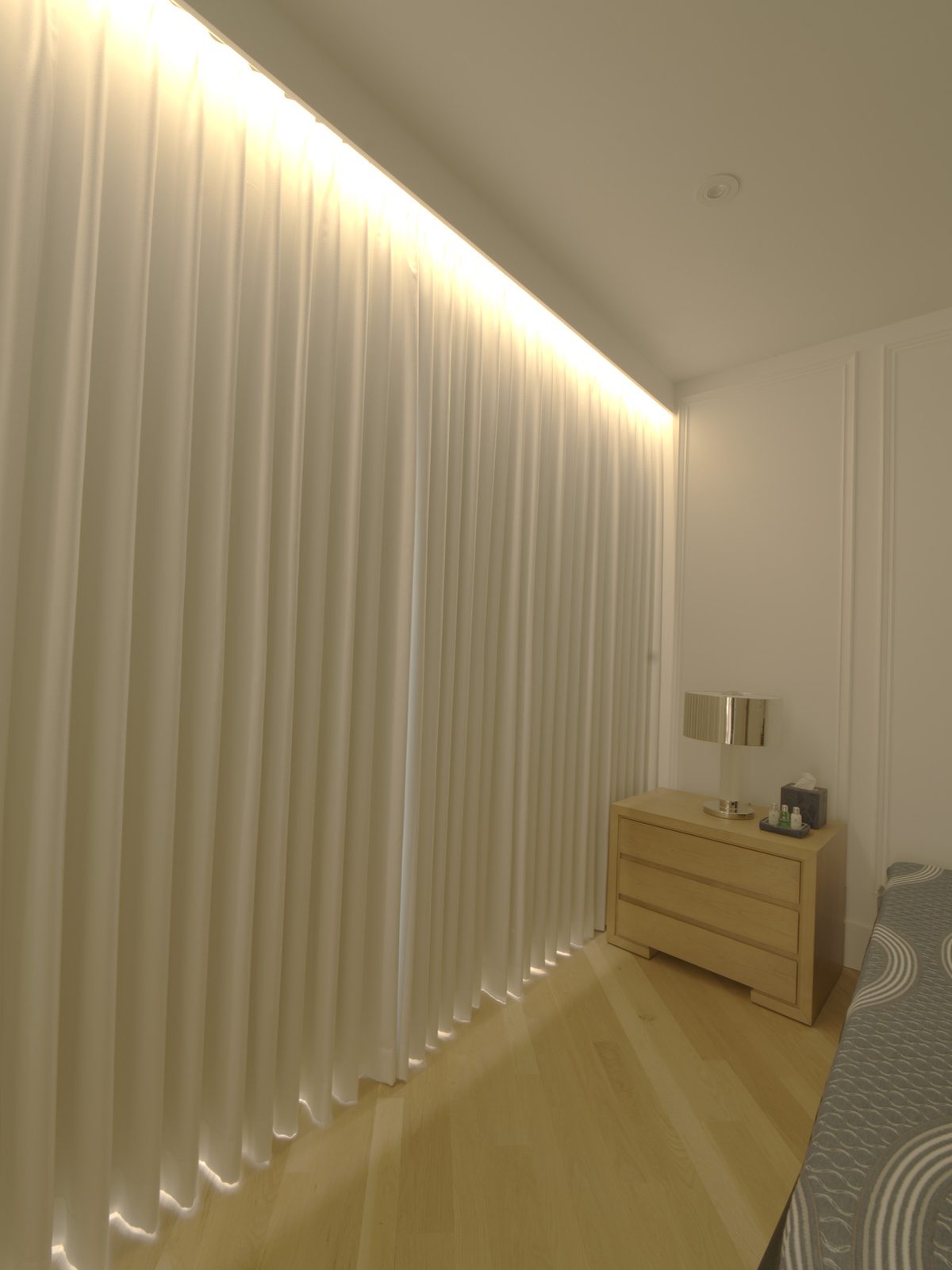 Custom wood valance concealing the ripplefold drapery track in a Boca Raton master bedroom