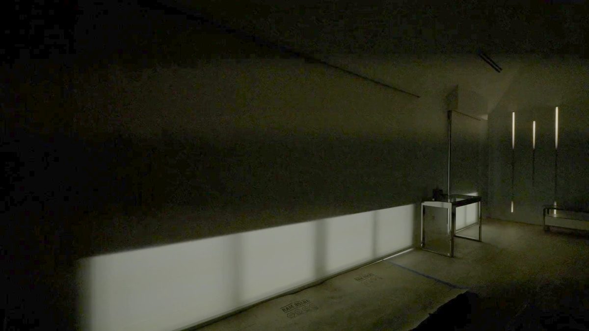 The same wall with the blackout layer of the dual shade lowered and the room dark