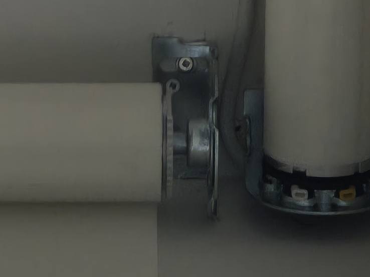 The coupler joining two roller tubes so one motor drives both