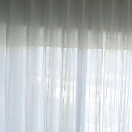 Villa Nova Geneva Chalk cotton-linen sheers installed on the recessed track in the living room