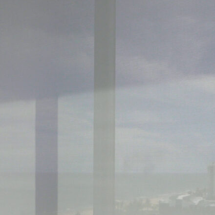 Mermet E Screen 3% White/White solar screen installed over the dining window, the view soft through it